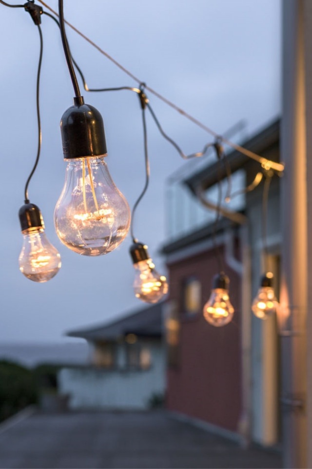 Festoon lights hanging outside garden and fence ideas