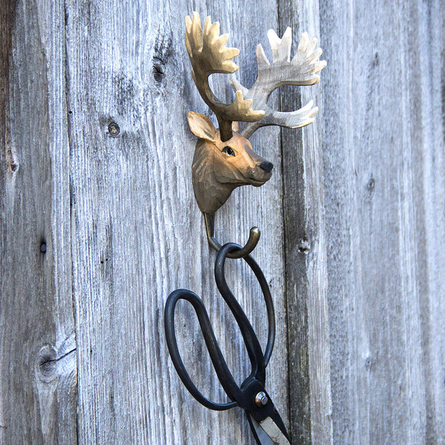 Deer hanger on garden fence