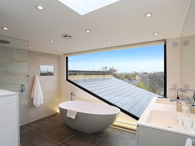 Opening up a bathroom with a dormer window with add light and space