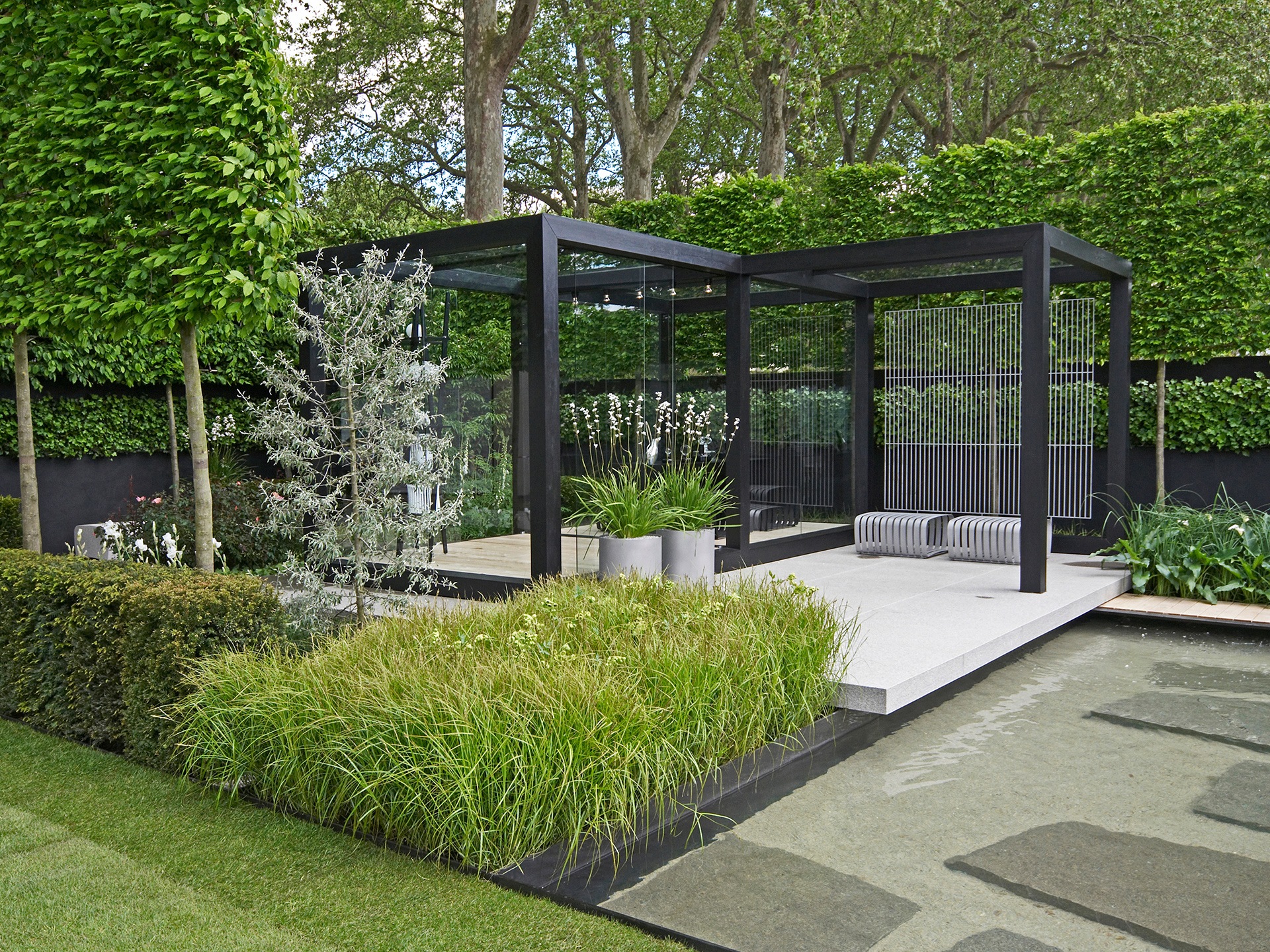 pool next to shelter in a garden 