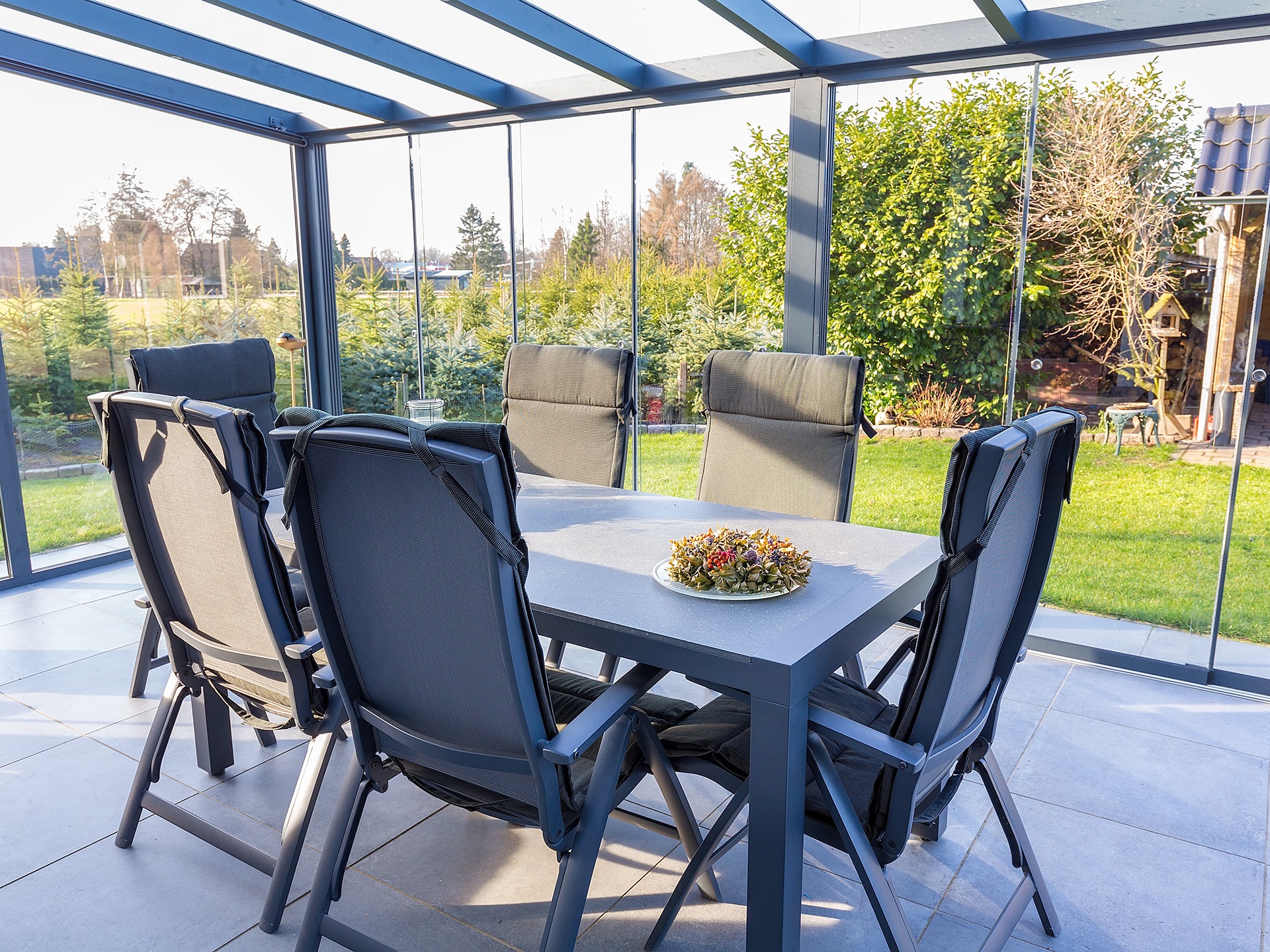 blue stained glass viranda with dining table and chairs