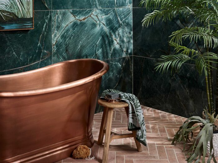 Large format marble-style tiles create a spa like experience in a bathroom