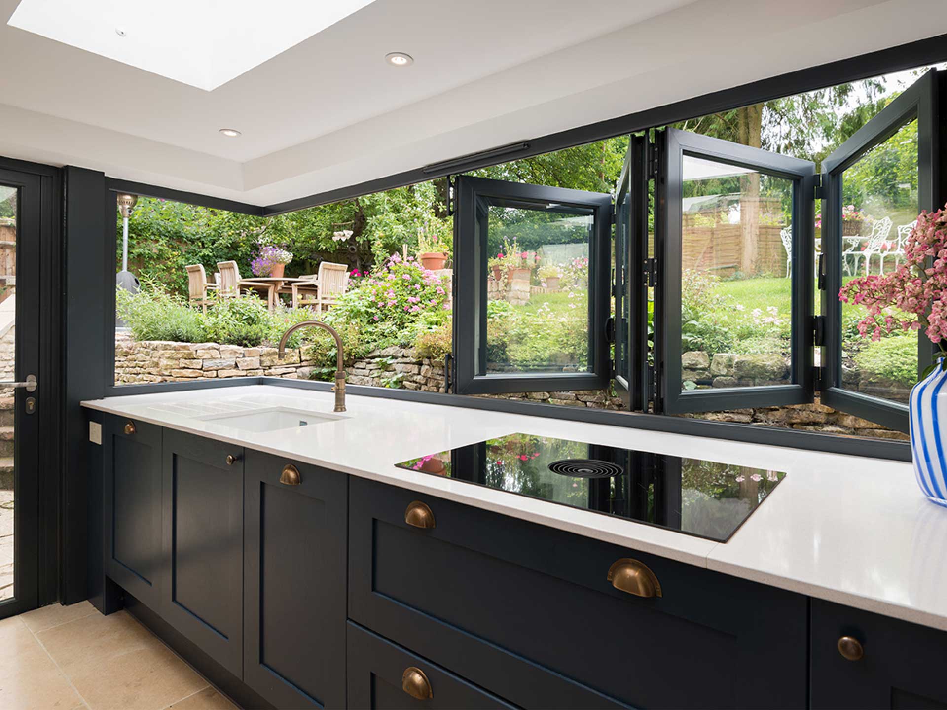 Try the latest trend of bi fold windows in your house renovation.Folding window with black rimmed edges