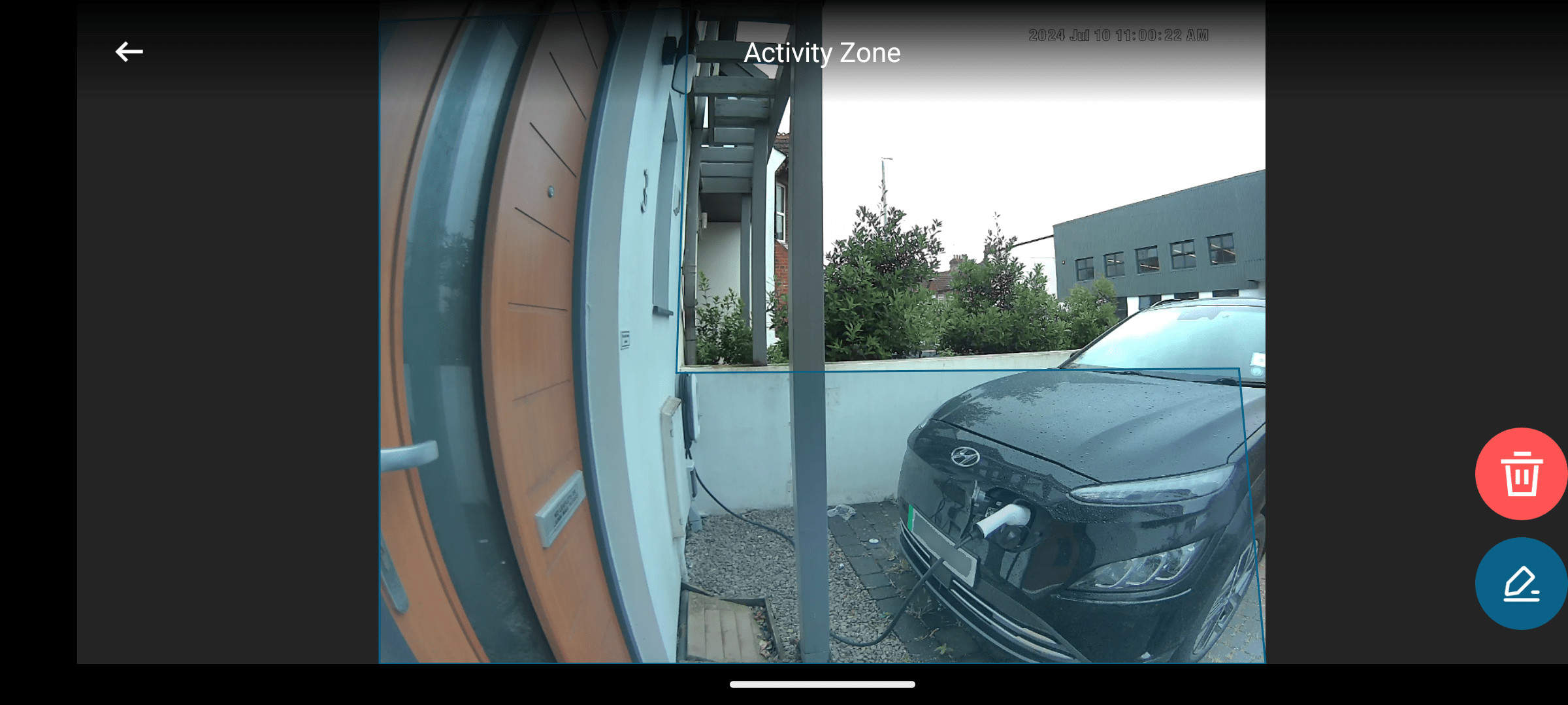 A view from a side-mounted smart doorbell. A thick, L-shaped activity zone covers the homeowner's property, but avoids the neighbour's land and trees.