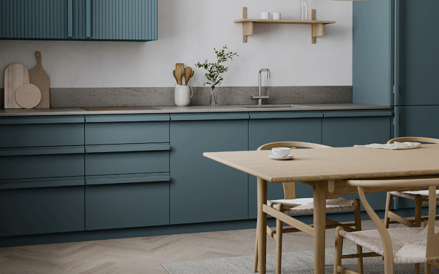 Galley kitchen with cabinets in blue and bar handles