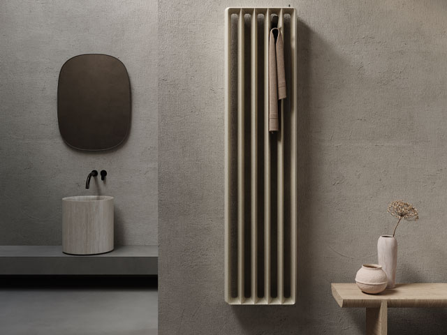 Vertical radiator on a bathroom wall