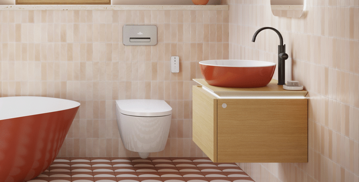 bathroom with countertop basin with orange exterior on vanity unit and matching freestanding bath