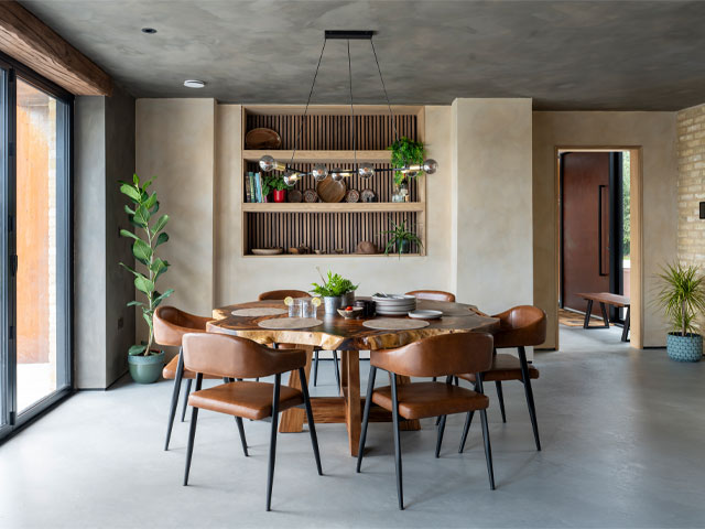 Dining area of an open-plan kitchen that leads out to the garden through 7m bi-fold doors