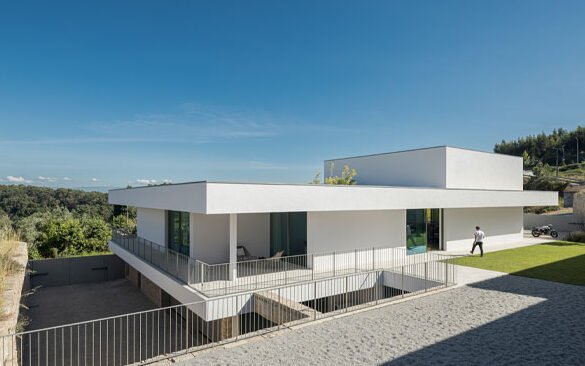 Exterior of contemporary white house on a sloping site