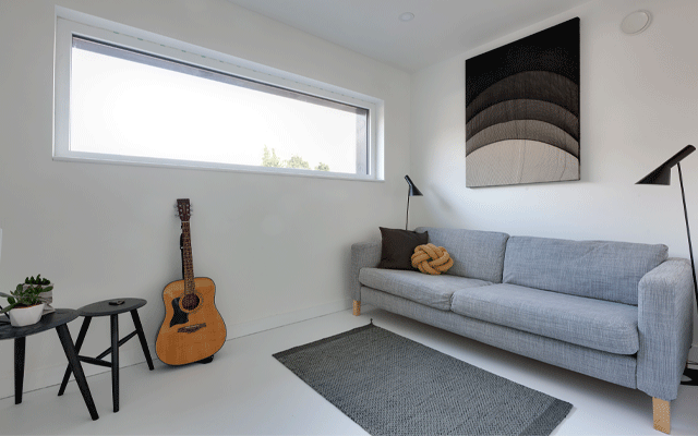 Living room in east London Passivhaus with high-level window