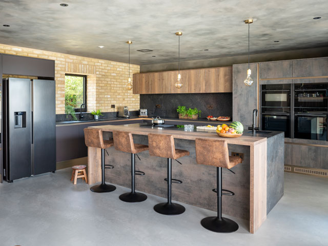 contemporary kitchen with grey surfaces including a waterfall island