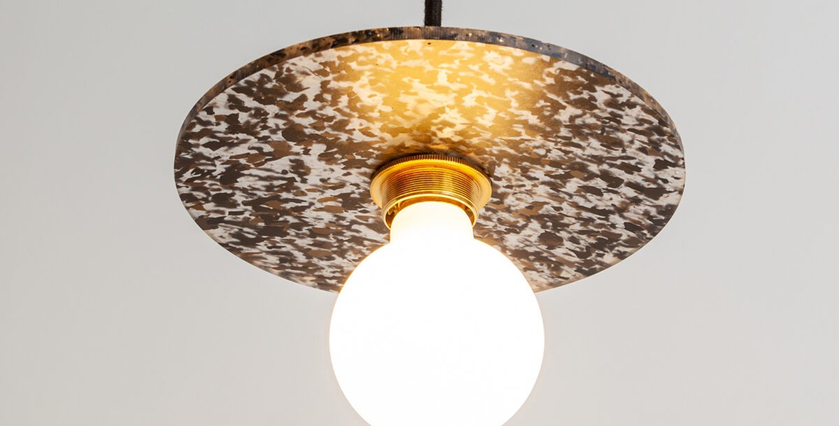 A pendant light made from recycled plastic