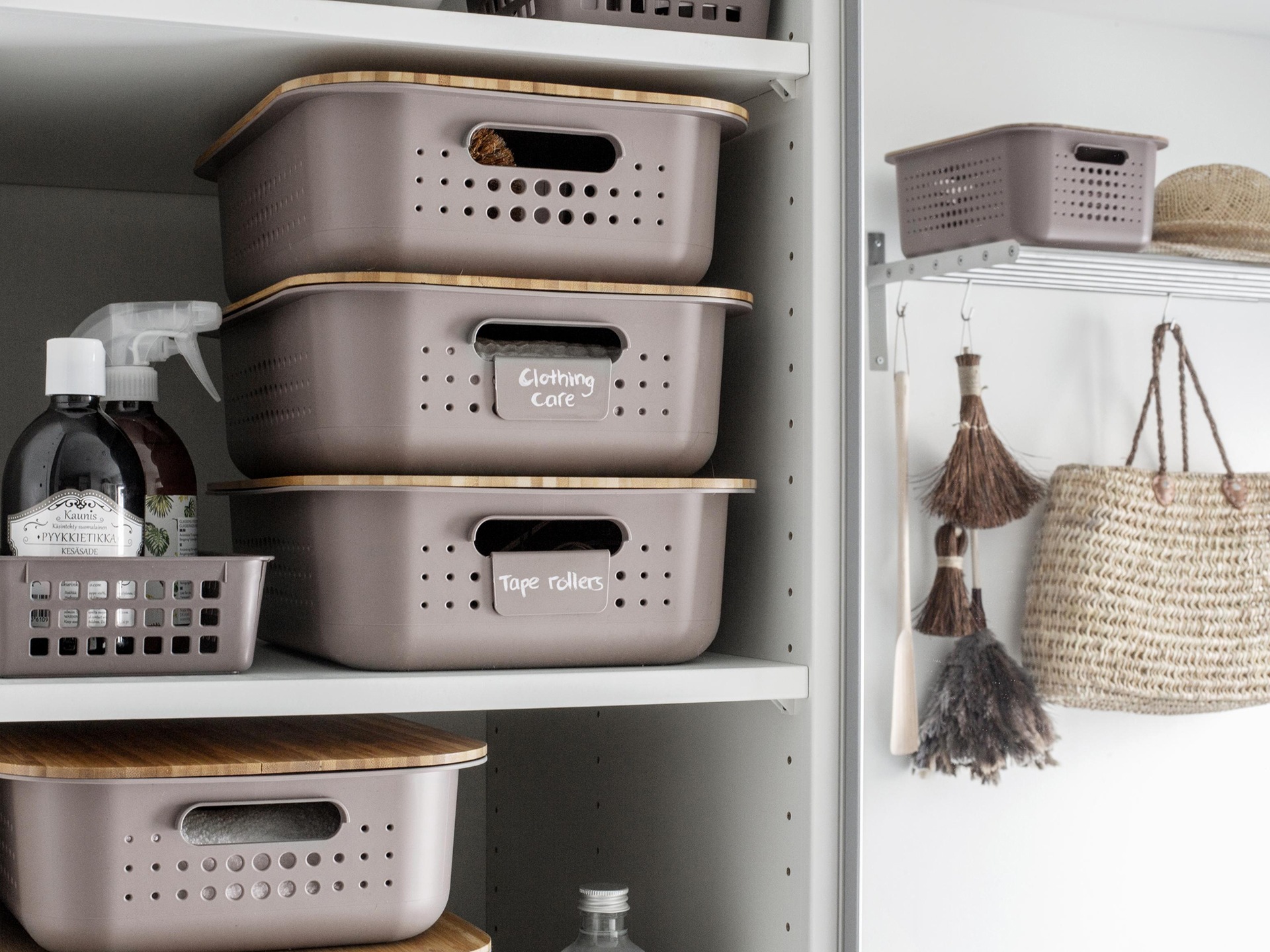 Recycled plastic storage boxes in a laundry cupboard 