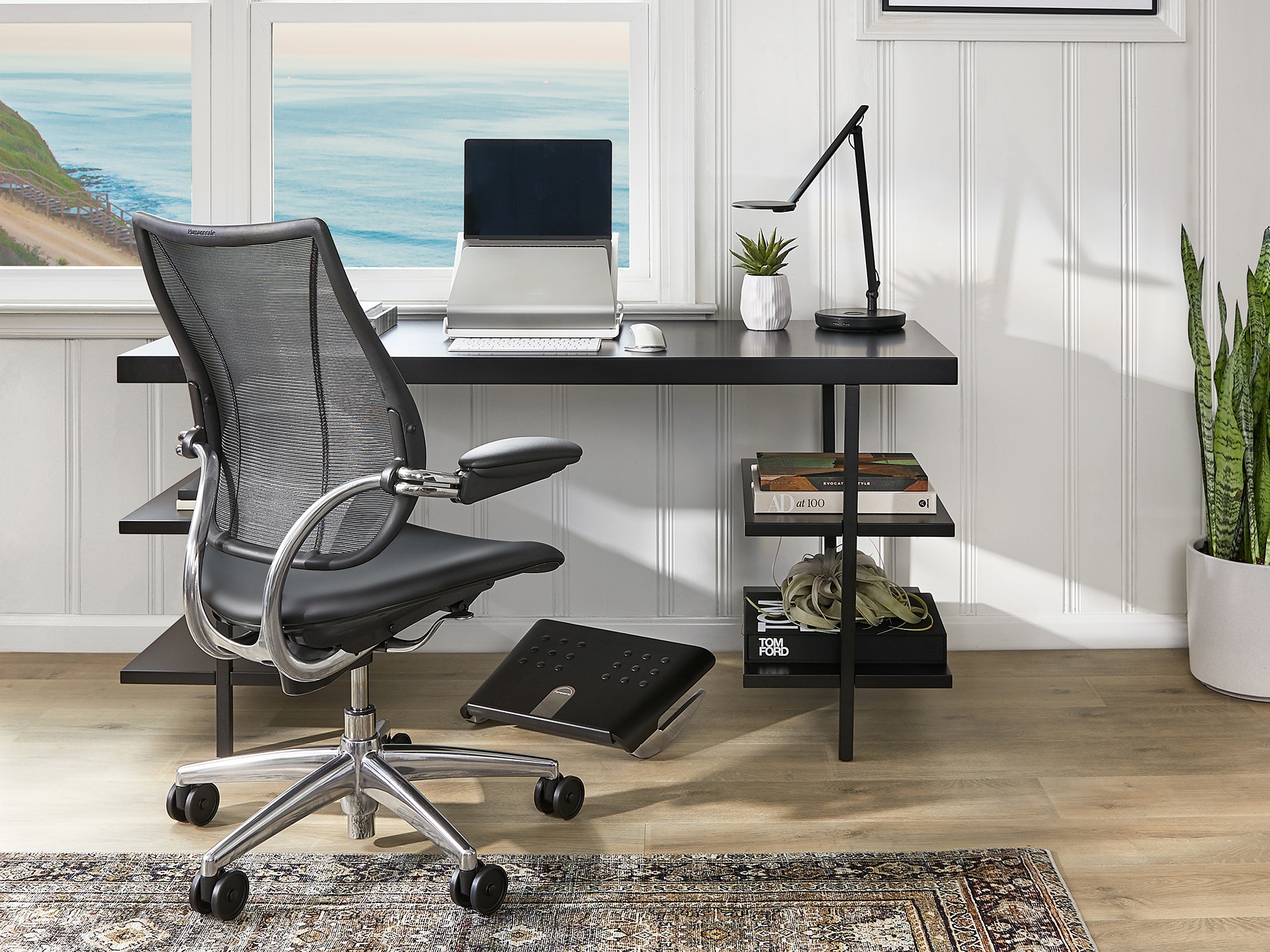 An office chair in an office overlooking the sea