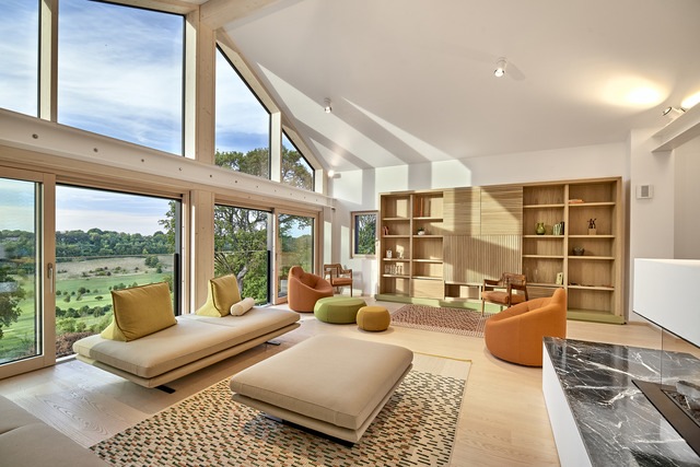 Living area of Baufritz property with beautiful landscape views