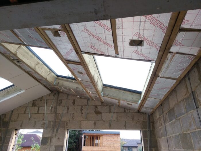 Foil-backed insulation between rafters in a roof