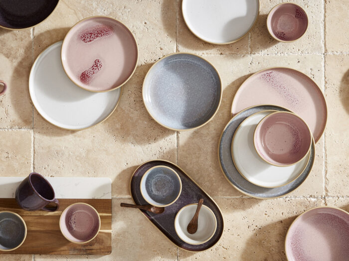 a collection of plates and bowls on the floor