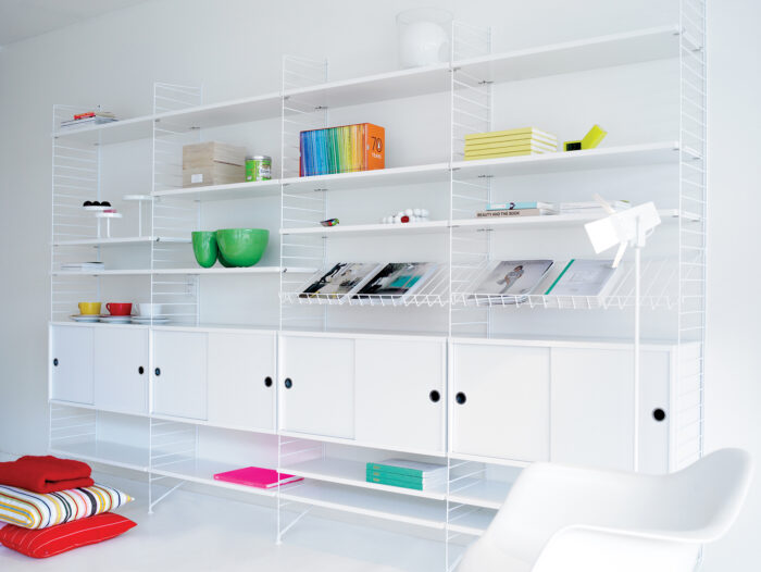 A contemporary shelving unit with neatly arranged accessories on it