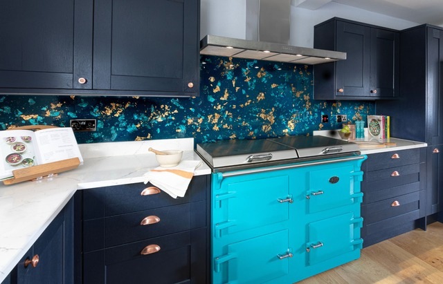 Metallic glass splashback in stunning antique peacock from Emma Britton in blue kitchen