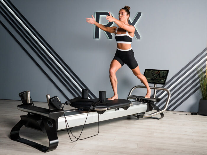 Woman on a Pilates reformer machine