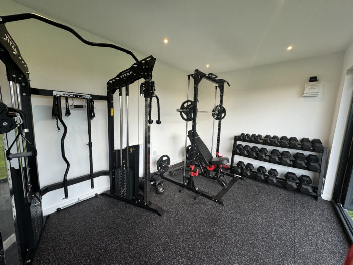 A home gym full of weight training equipment