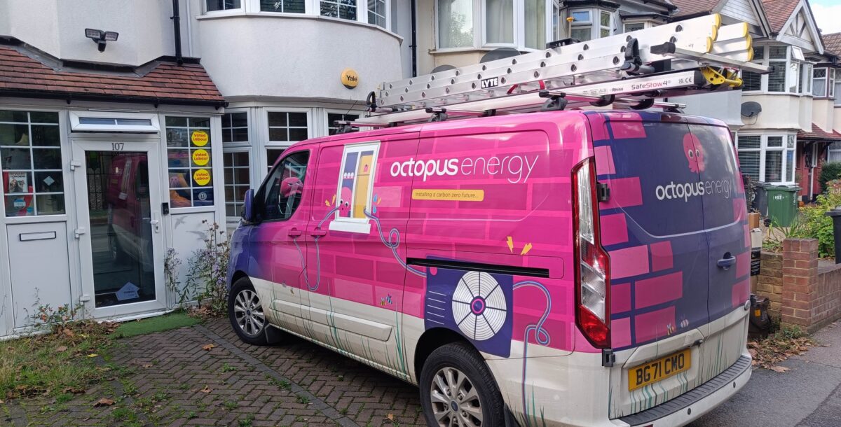 A very pink Octopus Energy van parked in a driveway